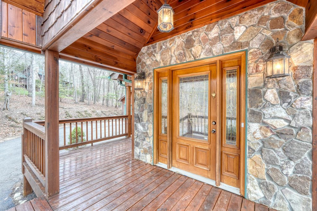 180 Shepherds Ridge Morganton, GA 30560 - Photo 23 of 66 a view of a porch with wooden floor and outdoor space