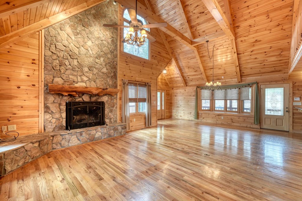 180 Shepherds Ridge Morganton, GA 30560 - Photo 34 of 66 a view of an empty room with wooden floor and a fireplace
