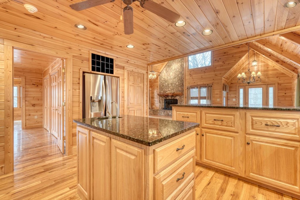 180 Shepherds Ridge Morganton, GA 30560 - Photo 39 of 66 a kitchen with stainless steel appliances granite countertop a sink and cabinets