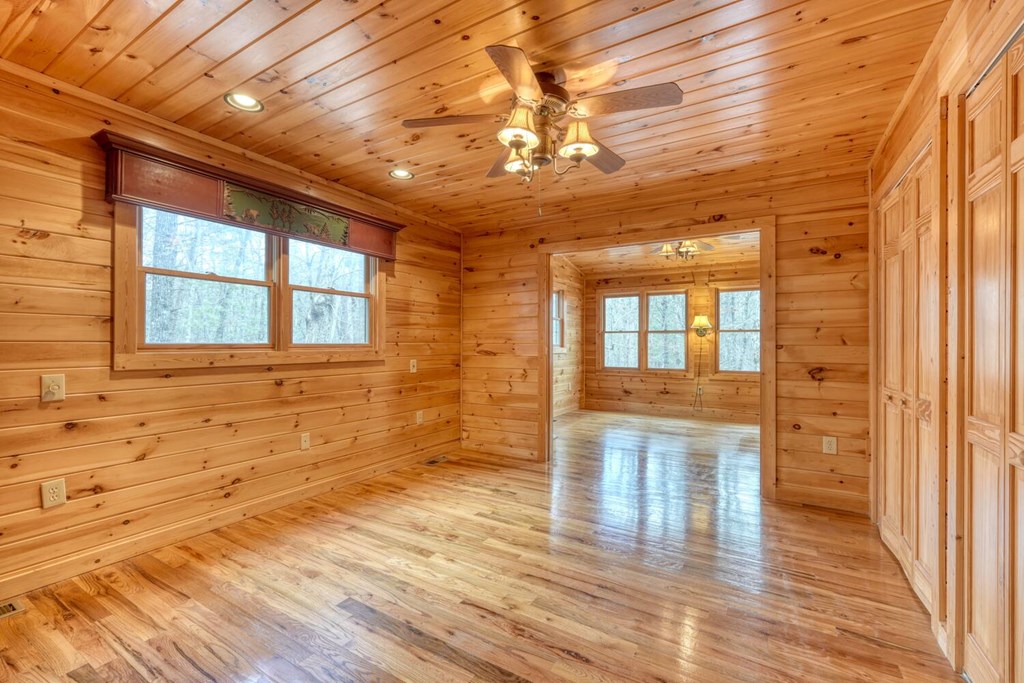 180 Shepherds Ridge Morganton, GA 30560 - Photo 41 of 66 a view of an empty room with wooden floor and a window
