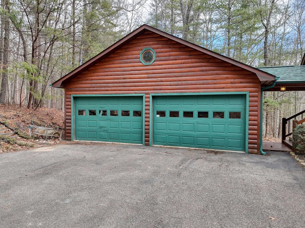 180 Shepherds Ridge Morganton, GA 30560 - Photo 7 of 66 a view of a house with a yard and garage