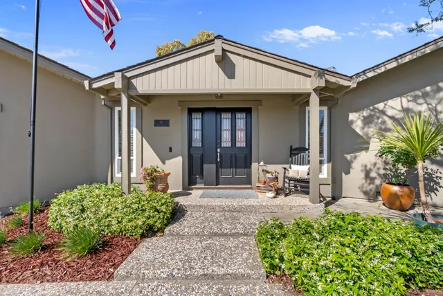 a front view of a house with garden