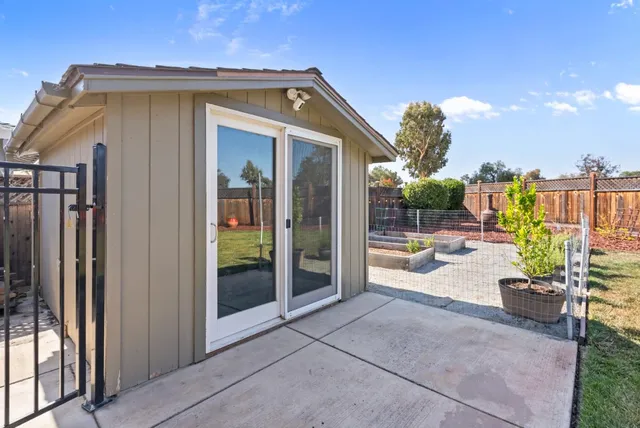 an aerial view of a house with a outdoor space