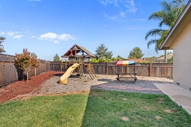 an aerial view of residential houses with outdoor space and street view