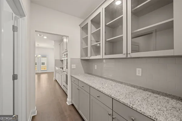 a hallway with cabinets