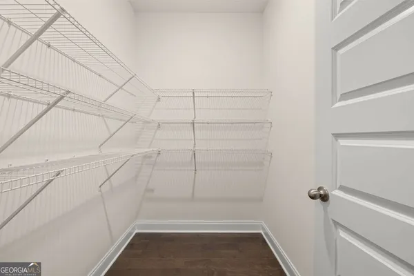 a view of a room with racks on the wall