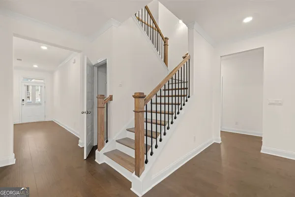 a view of a hallway with staircase