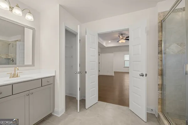 a bathroom with a double vanity sink and mirror