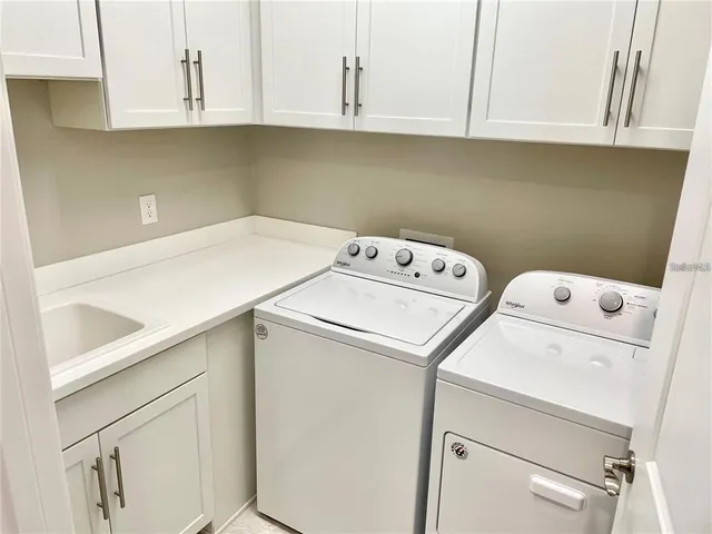 a utility room with dryer and washer