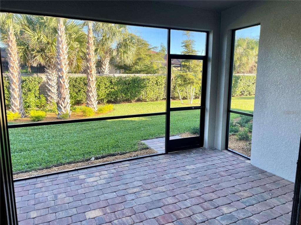 5748 Bay Pine Way Sarasota, FL 34238 - Photo 18 of 24 a view of a garden with an outdoor seating space