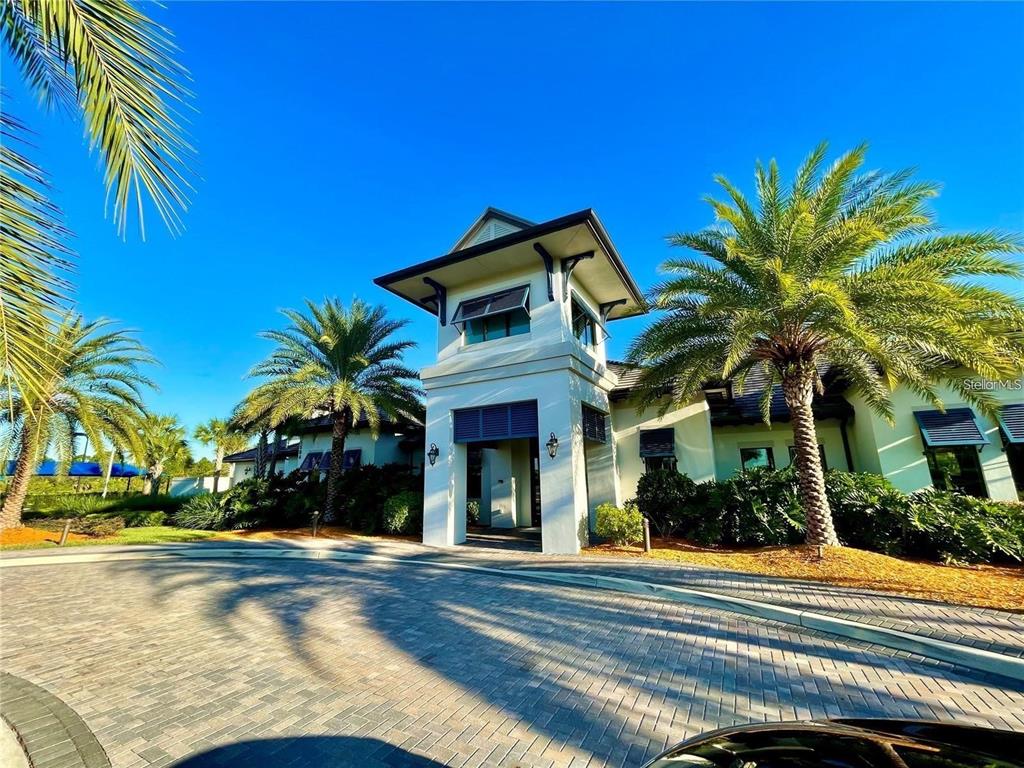 5748 Bay Pine Way Sarasota, FL 34238 - Photo 20 of 24 a front view of a house with a yard