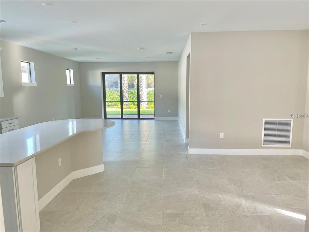 5748 Bay Pine Way Sarasota, FL 34238 - Photo 4 of 24 a view of an empty room with a window