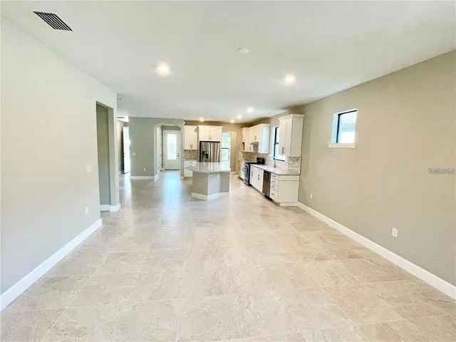 a view of a kitchen with a sink and cabinets