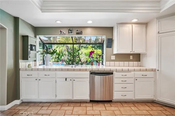 an aerial view of a house with a backyard