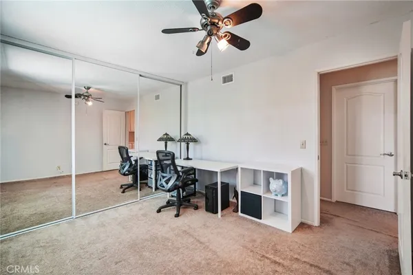 a room with pool table and glass door