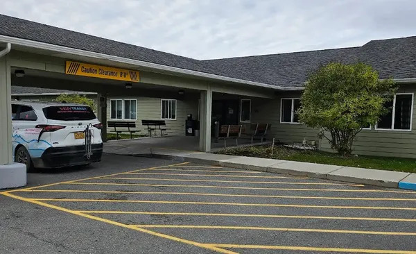 a view of a building and car parked