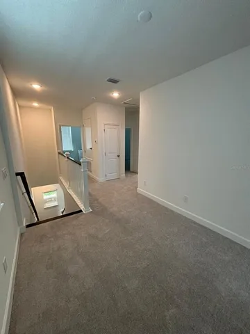 a view of a livingroom and a staircase