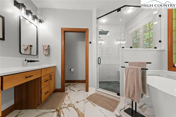 a balcony with furniture and a potted plant