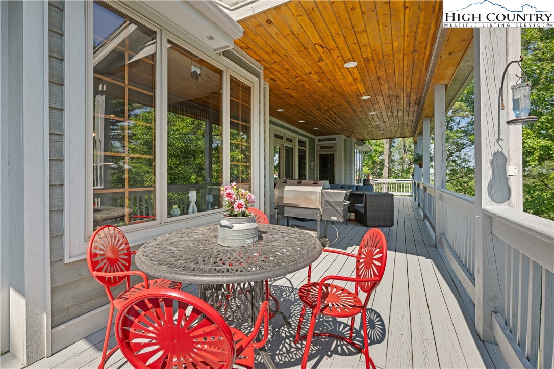 128 East Pinecrest Court Boone, NC 28607 - Photo 18 of 46 a outdoor space with the couches and dining table with garden view