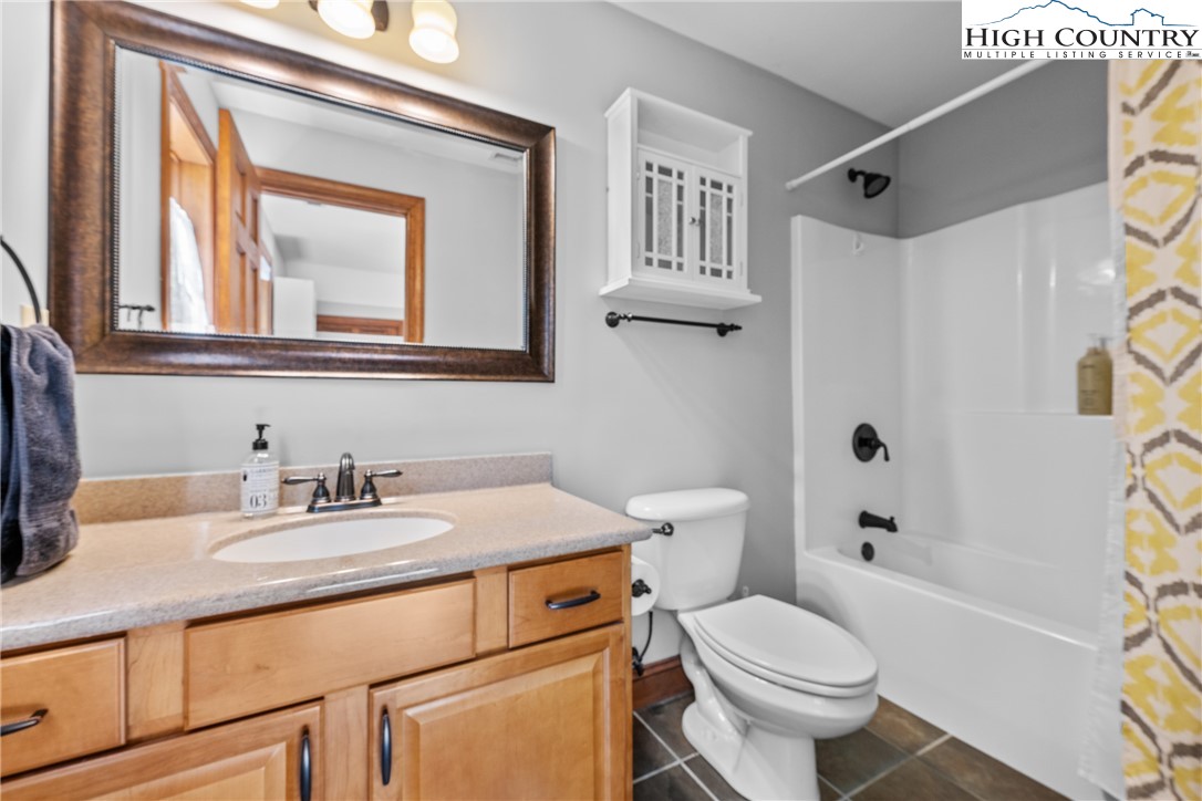 128 East Pinecrest Court Boone, NC 28607 - Photo 24 of 46 a bathroom with a sink toilet vanity and shower