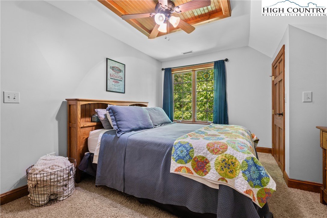 128 East Pinecrest Court Boone, NC 28607 - Photo 25 of 46 a bedroom with a bed and a window