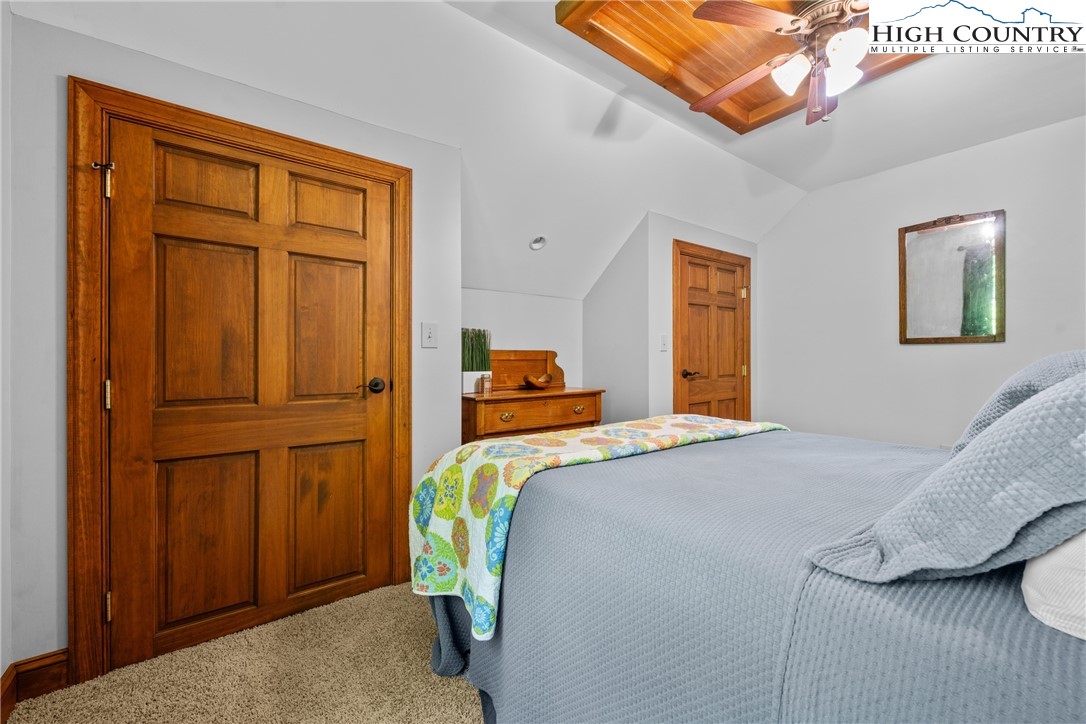128 East Pinecrest Court Boone, NC 28607 - Photo 26 of 46 a bedroom with a bed and a window