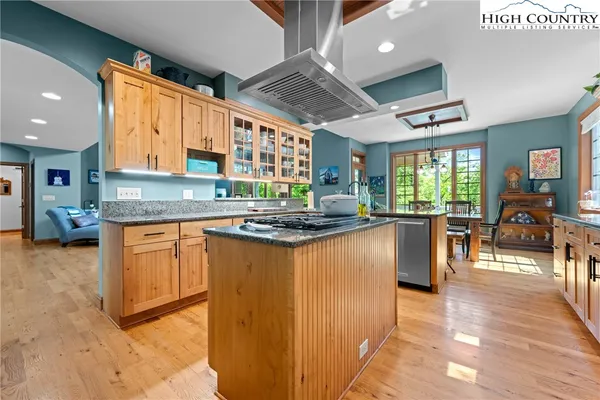a kitchen with stainless steel appliances granite countertop a stove and a sink