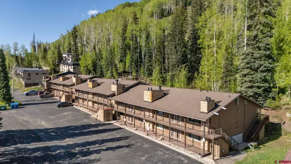 a view of a patio with chairs and a table