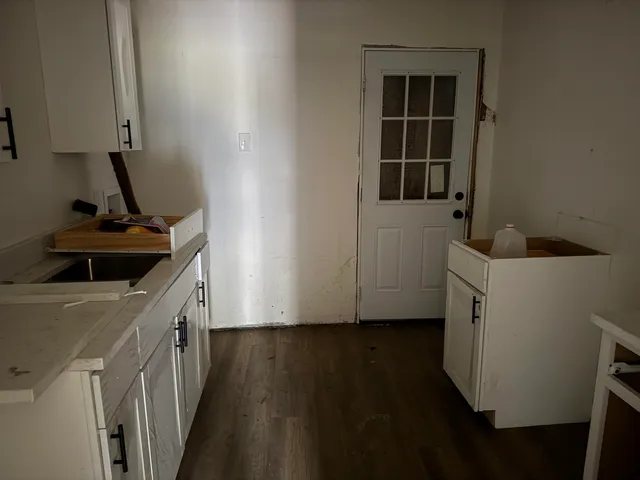 a kitchen with a sink and cabinets
