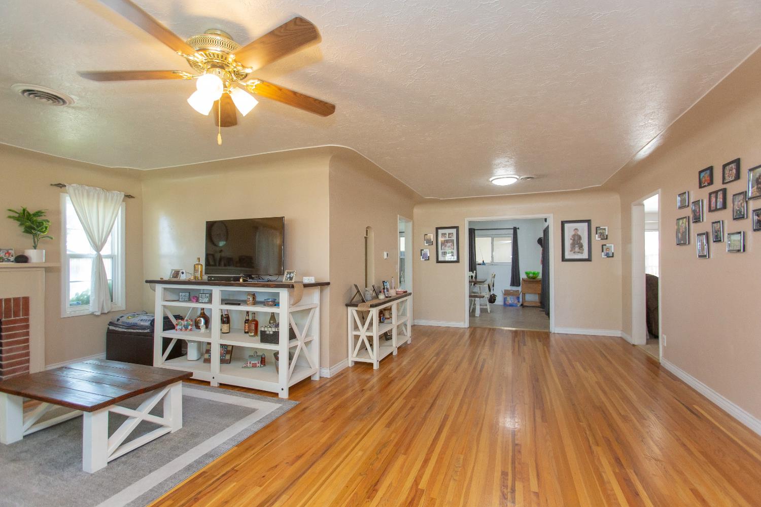 401 Fortuna Avenue Modesto, CA 95354 - Photo 10 of 43 a view of a livingroom with furniture and a flat screen tv