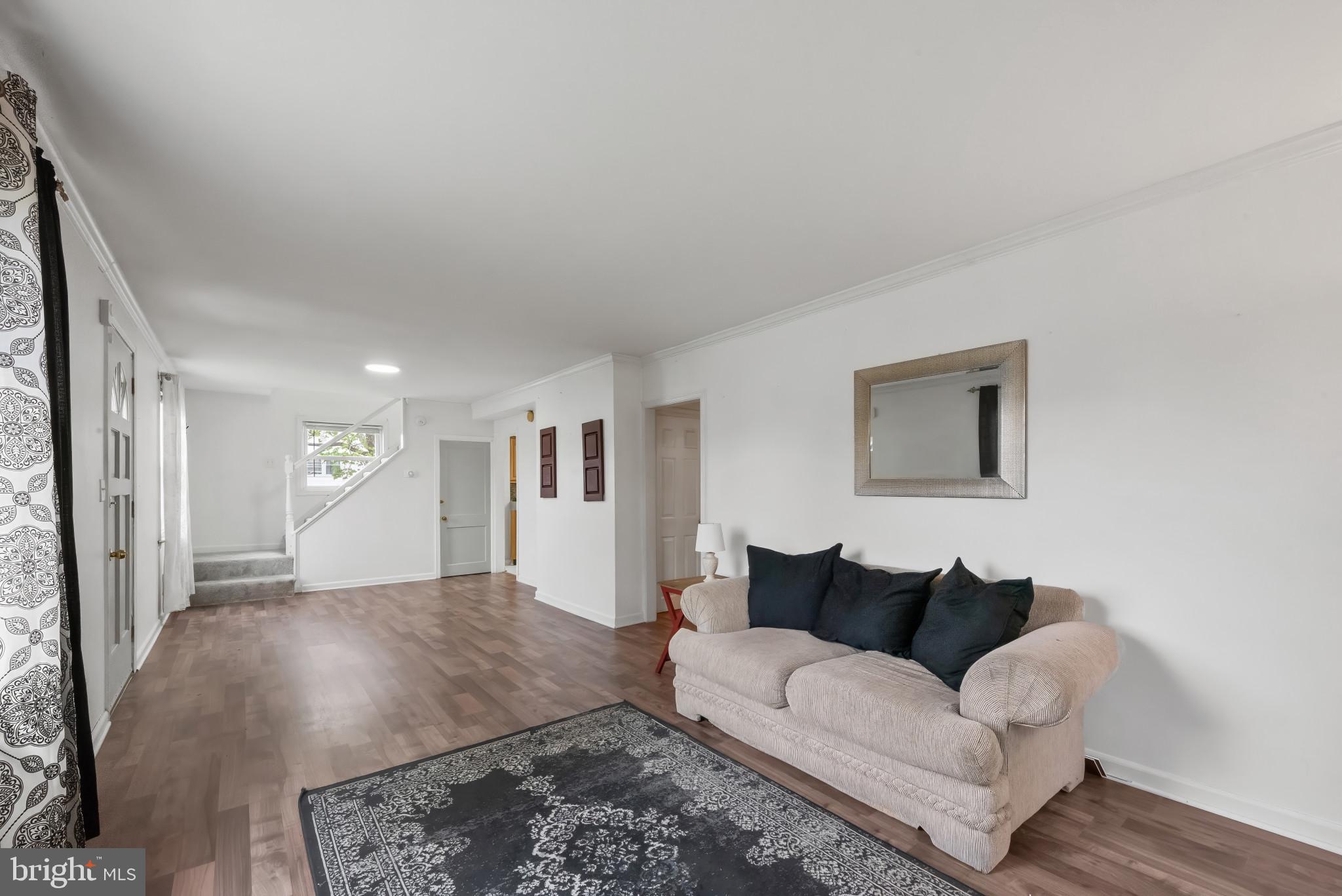 735 Cliffedge Road Baltimore, MD 21208 - Photo 4 of 39 a living room with furniture and a rug