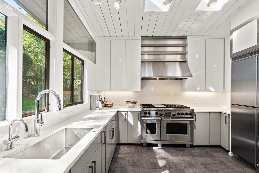 83 Ridgeway Road Weston, MA 02493 - Photo 11 of 32 a kitchen with a stove and a sink