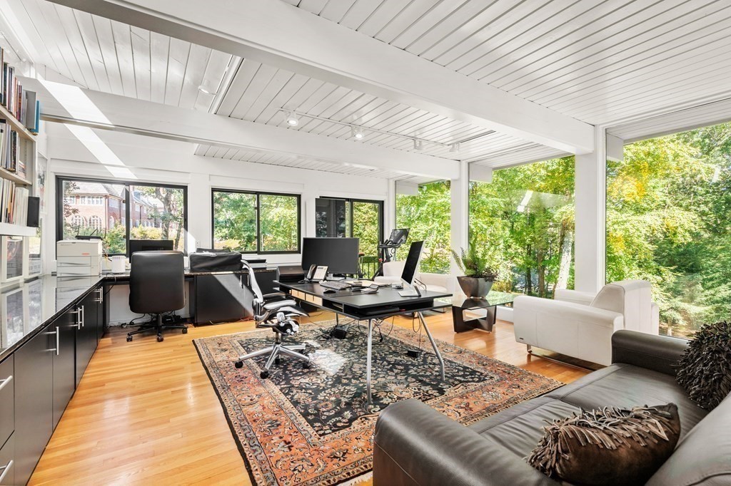 83 Ridgeway Road Weston, MA 02493 - Photo 14 of 32 a living room with furniture large windows and wooden floor