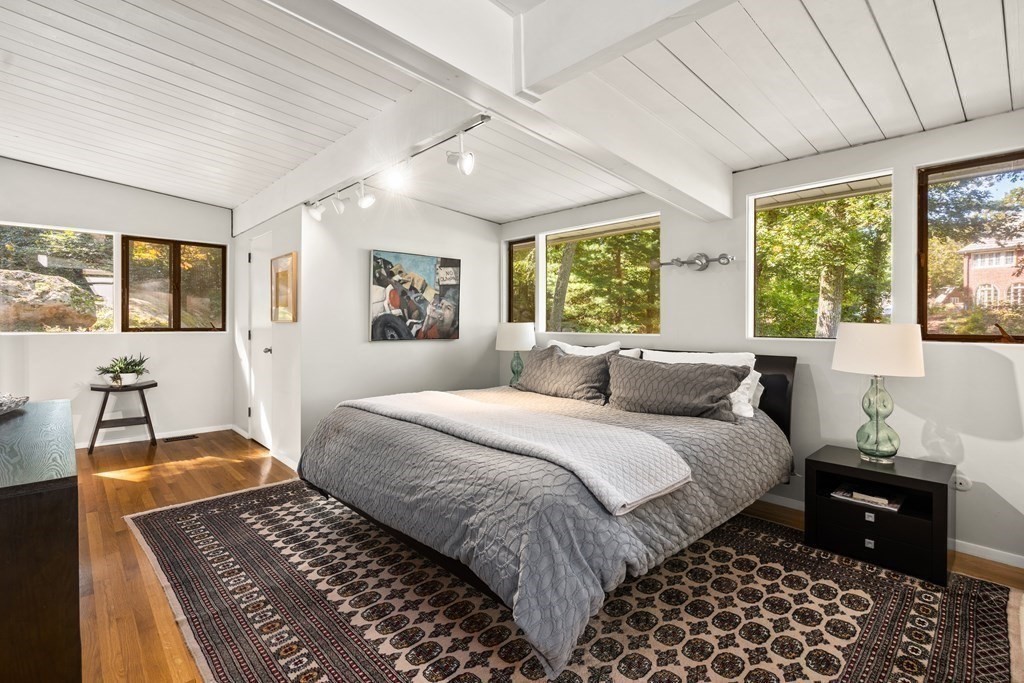 83 Ridgeway Road Weston, MA 02493 - Photo 16 of 32 a bedroom with a large bed and a window