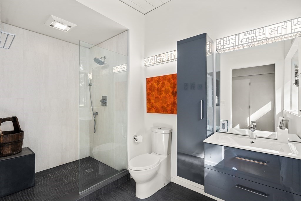 83 Ridgeway Road Weston, MA 02493 - Photo 17 of 32 a bathroom with a sink and a mirror