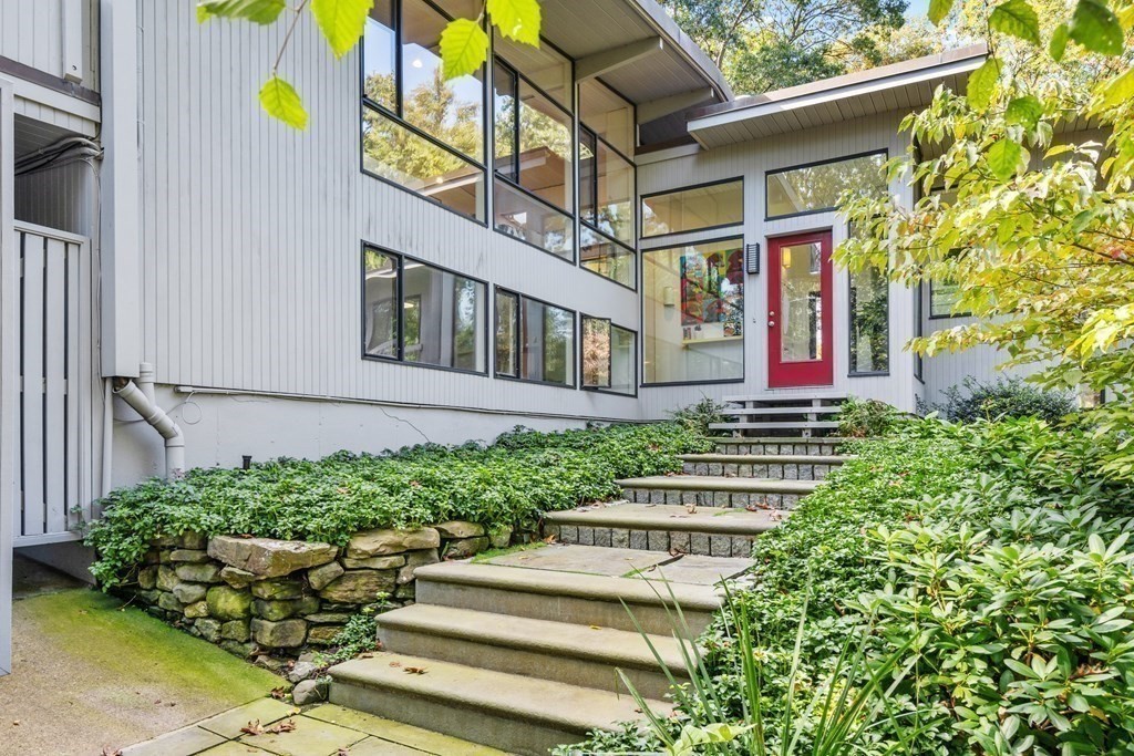 83 Ridgeway Road Weston, MA 02493 - Photo 2 of 32 a front view of a multi story residential apartment building with yard