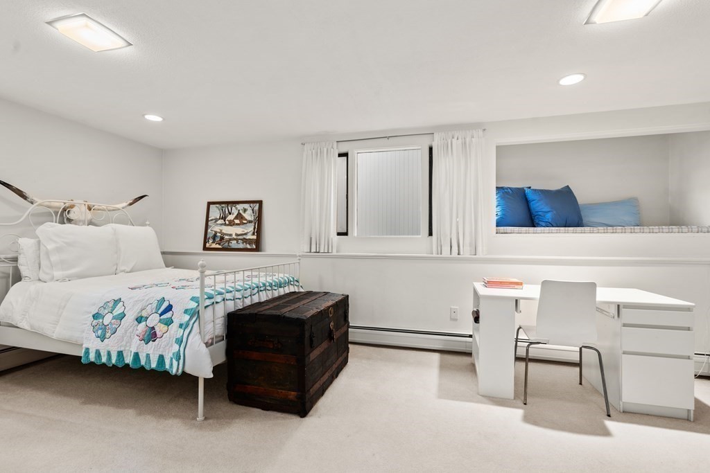 83 Ridgeway Road Weston, MA 02493 - Photo 22 of 32 a bedroom with a bed and lamp