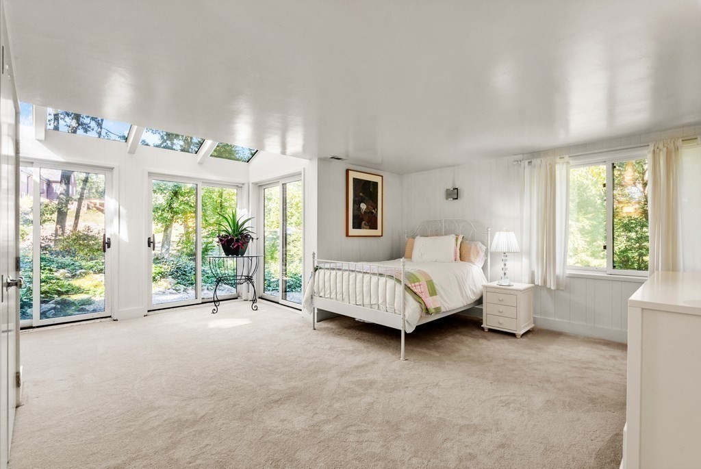 83 Ridgeway Road Weston, MA 02493 - Photo 23 of 32 a bedroom with a bed and large window