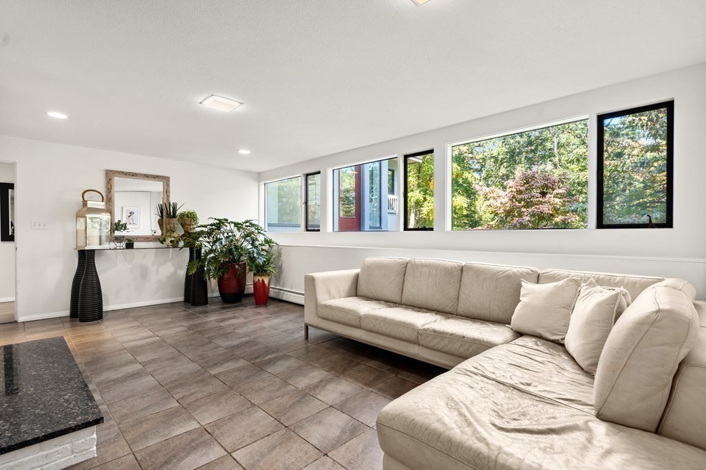 83 Ridgeway Road Weston, MA 02493 - Photo 24 of 32 a living room with furniture and a large window