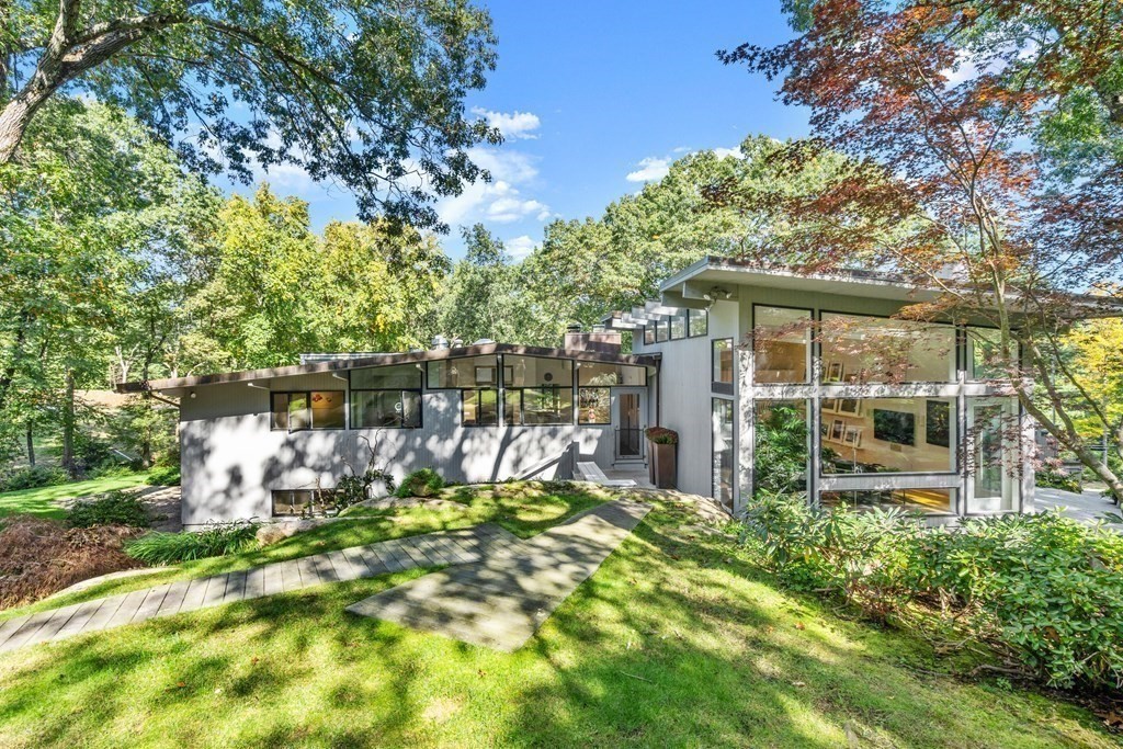 83 Ridgeway Road Weston, MA 02493 - Photo 25 of 32 a garden view with iron fence