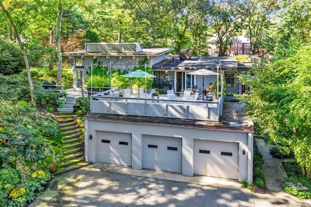 83 Ridgeway Road Weston, MA 02493 - Photo 27 of 32 a view of a house with a sink and yard with plants