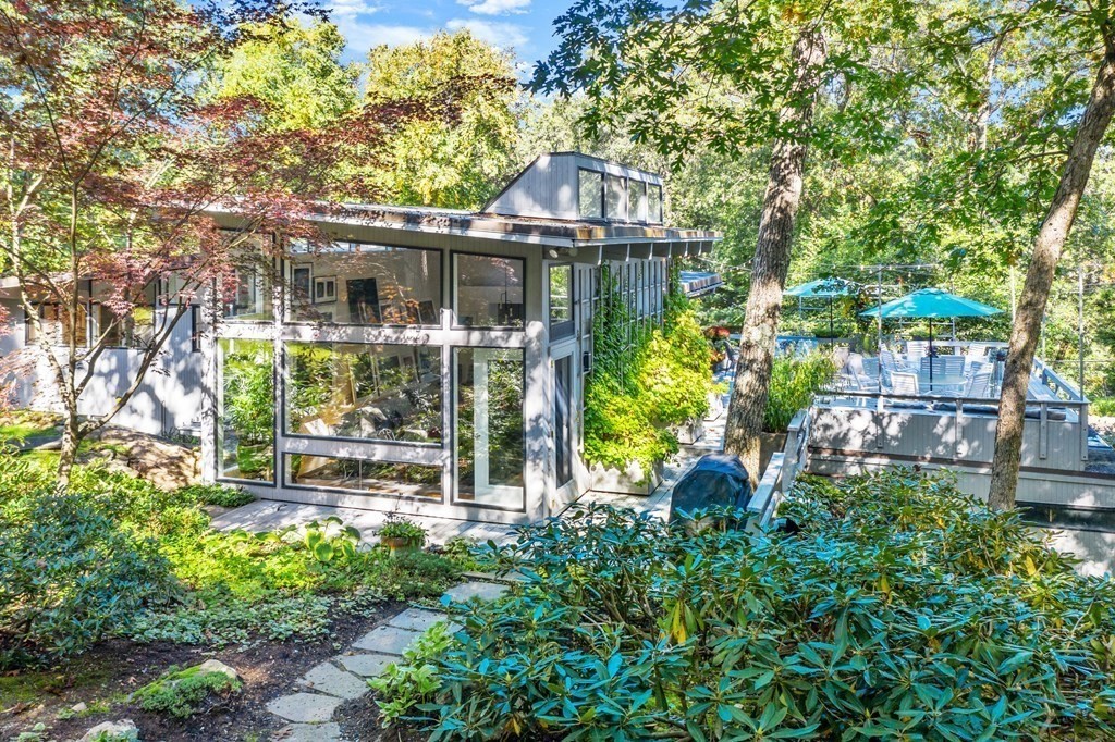 83 Ridgeway Road Weston, MA 02493 - Photo 29 of 32 a front view of a house with a yard