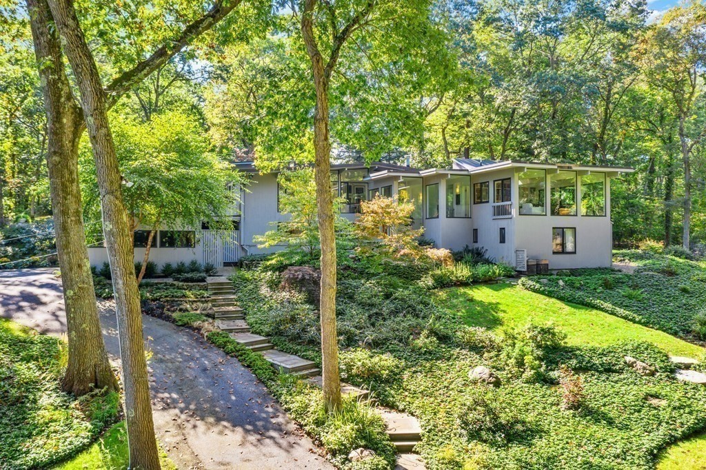 83 Ridgeway Road Weston, MA 02493 - Photo 3 of 32 a view of a house with a yard and plants