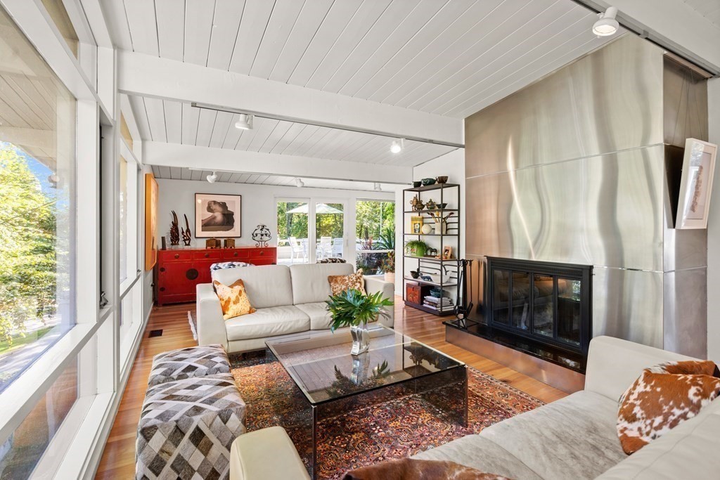 83 Ridgeway Road Weston, MA 02493 - Photo 5 of 32 a living room with furniture fireplace and a large window