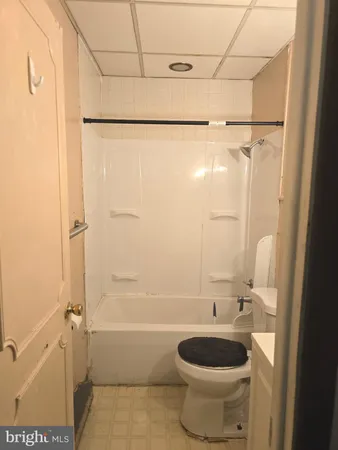 a bathroom with a toilet and shower