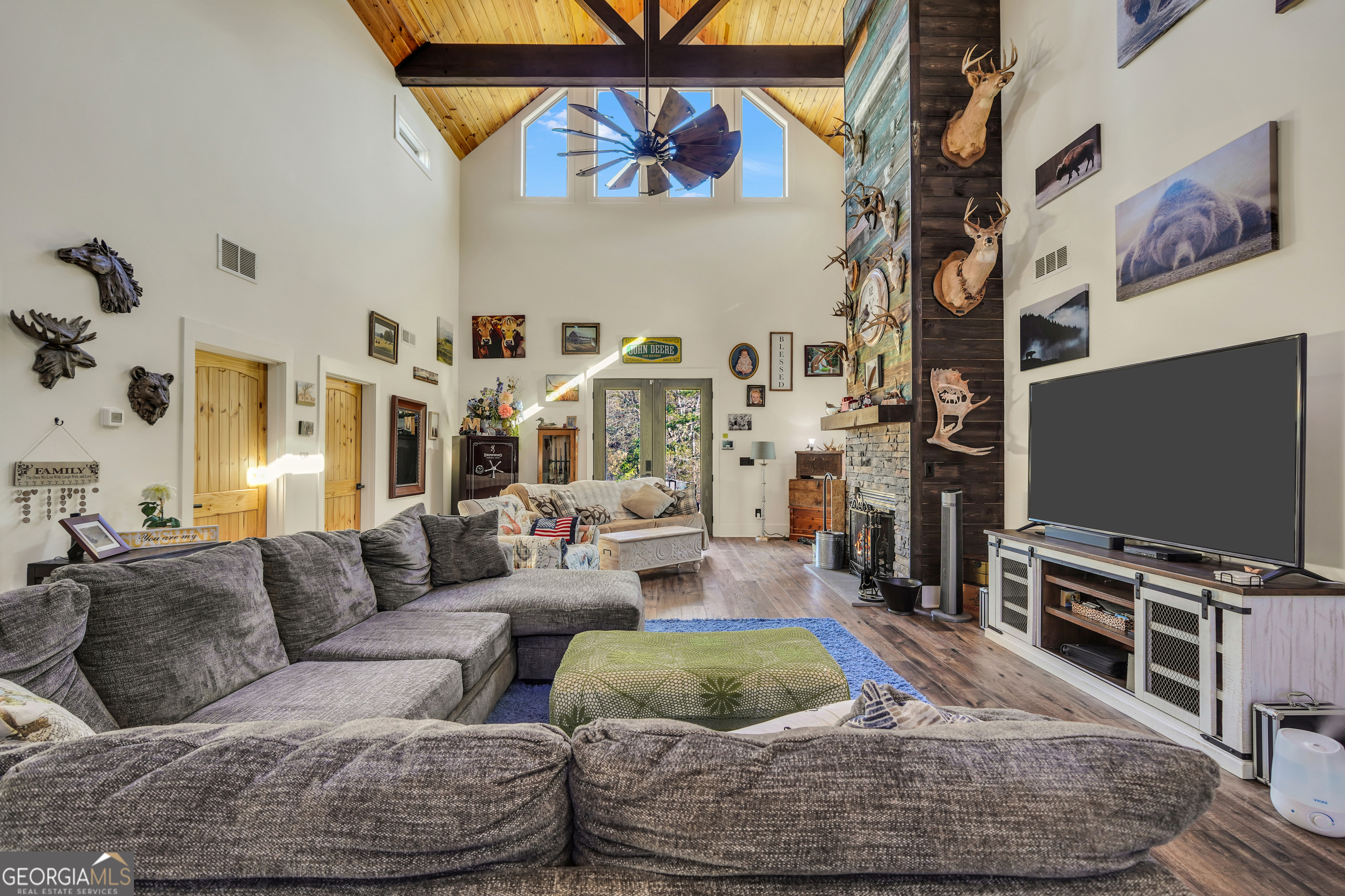 616 Shackelford Road Griffin, GA 30224 - Photo 14 of 64 a living room with furniture and a flat screen tv