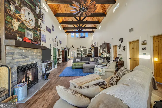a dining table with chairs and wooden floor