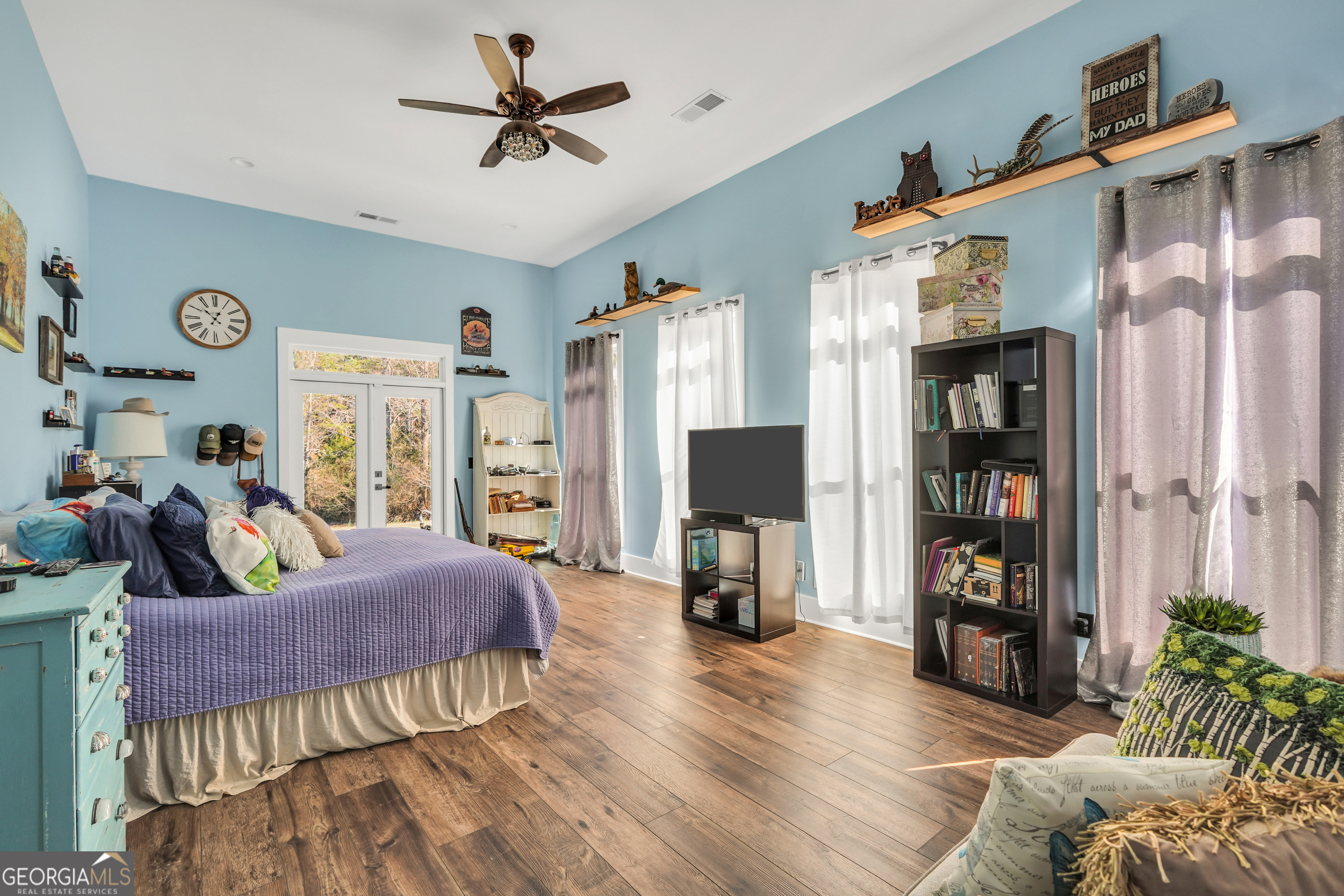 616 Shackelford Road Griffin, GA 30224 - Photo 29 of 64 a living room with furniture and a flat screen tv