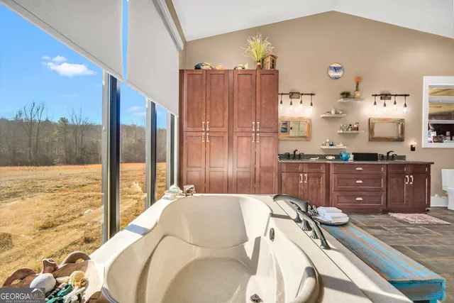 a kitchen with stainless steel appliances granite countertop a stove and cabinets