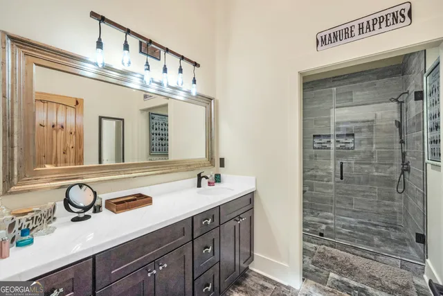 a view of a house with a yard and large tree